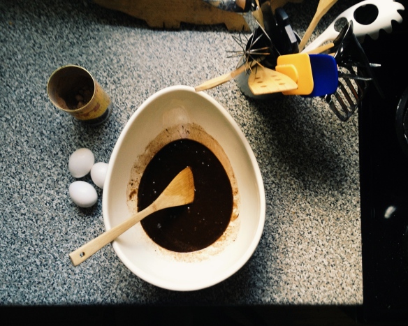 a bowl of brownie batter and eggs