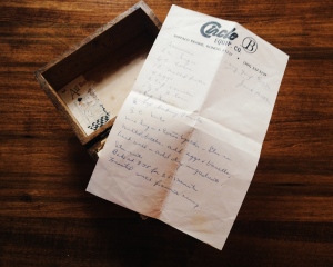 An old wooden recipe box with a recipe
